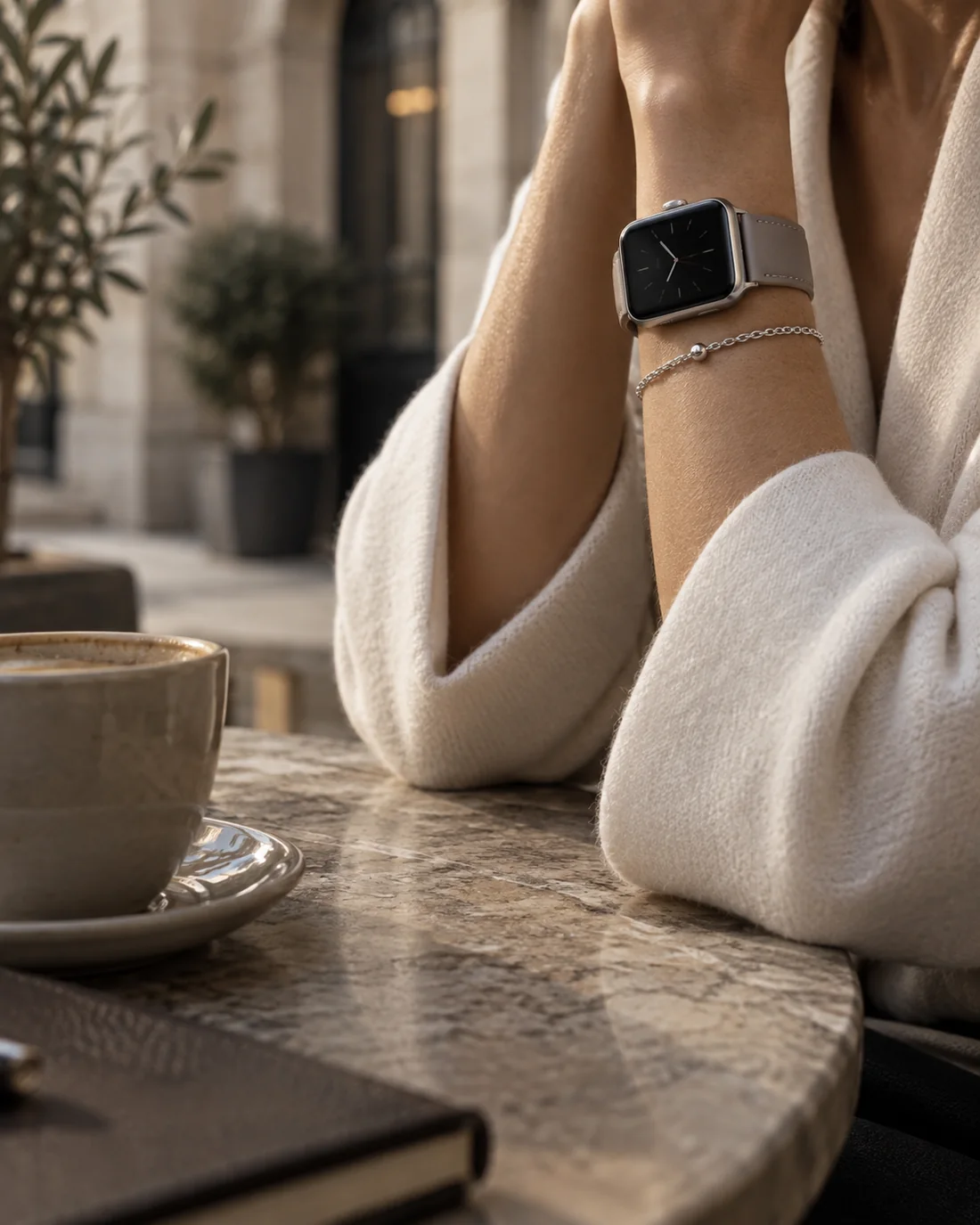 Watch styling with a neutral band and silver jewelry