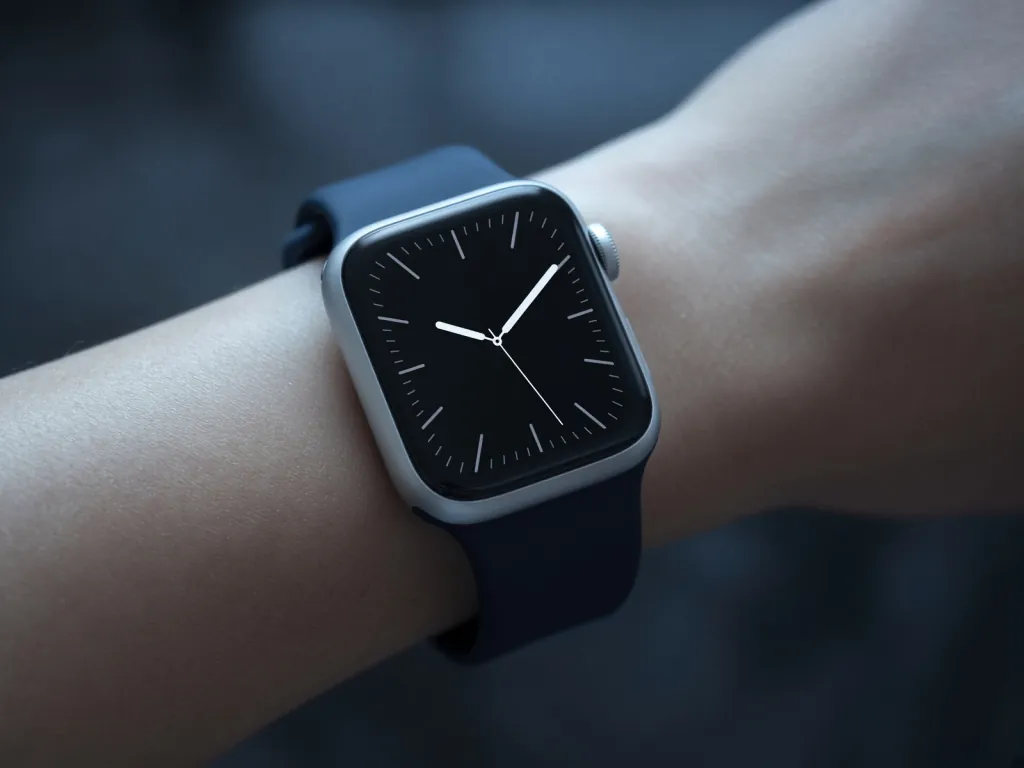 Close-up of an Apple Watch with a dark analog face